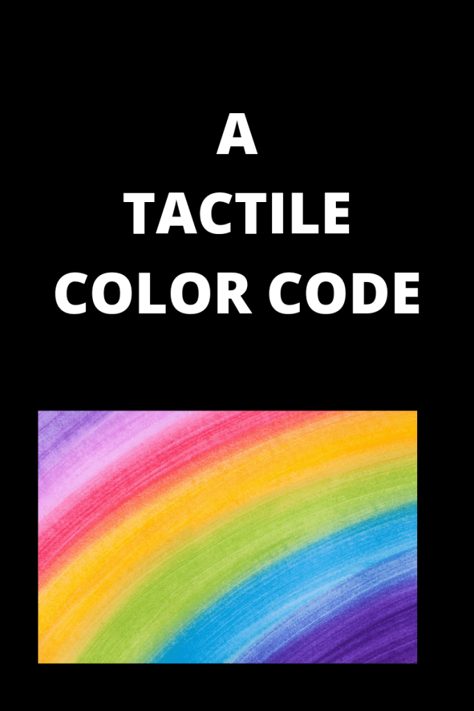Photo description
Text reads a tactile color code
There is a graphic showing the colors of the rainbow below the text. Text is white and the background is black